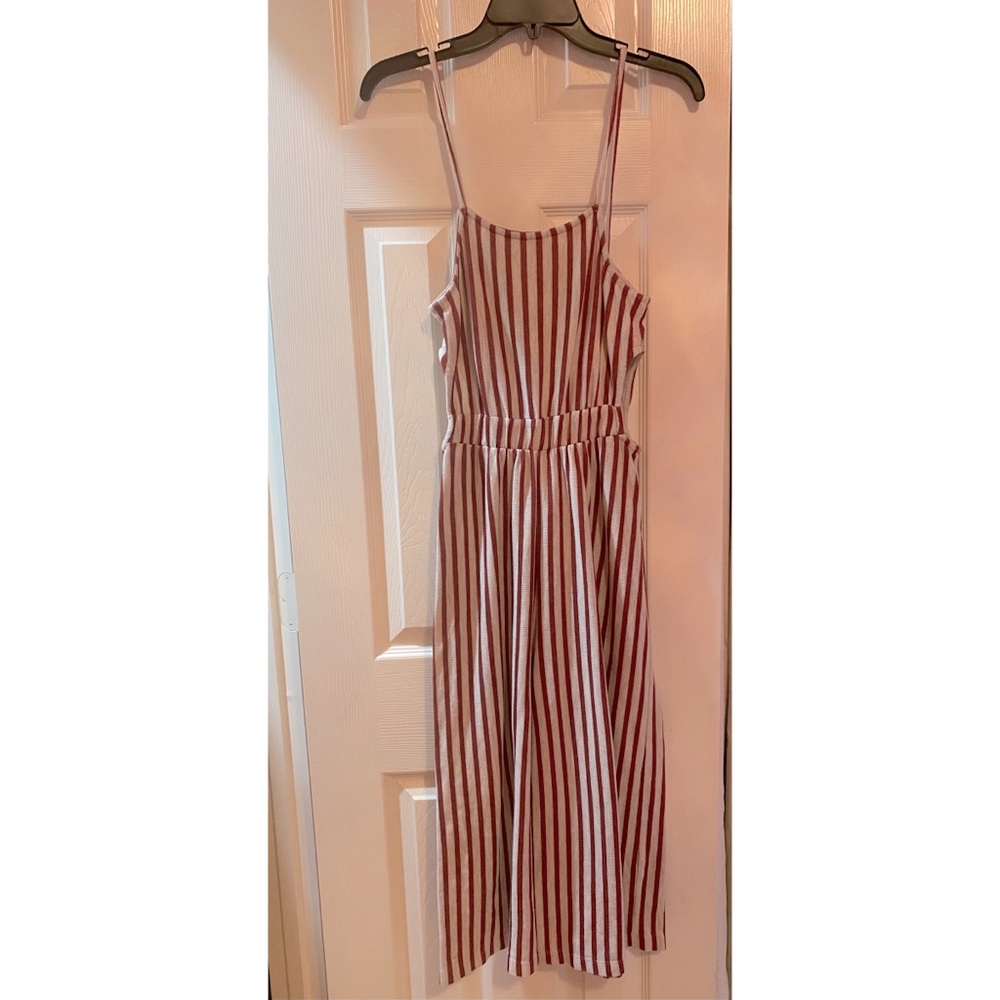 Striped red jumpsuit with side cutouts